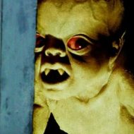 Demon baby with glowing red eyes